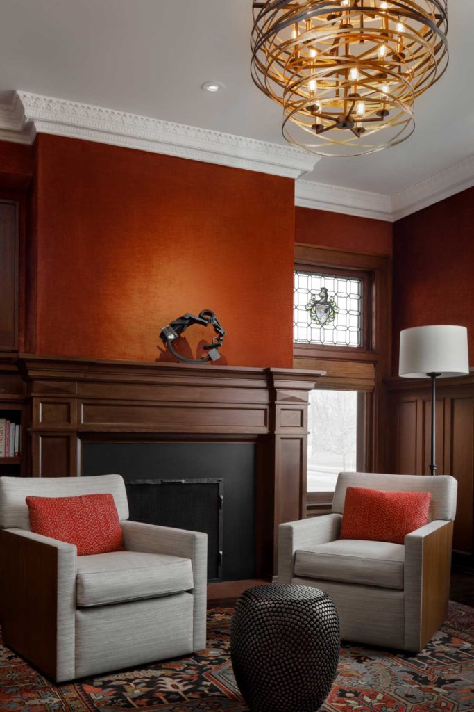 Den with fireplace and modern lighting
