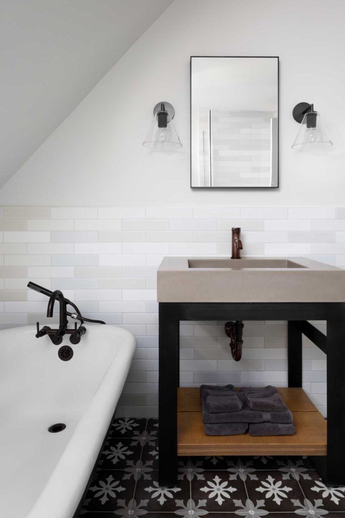 Bathroom with cast iron tub and modern pedestal sink