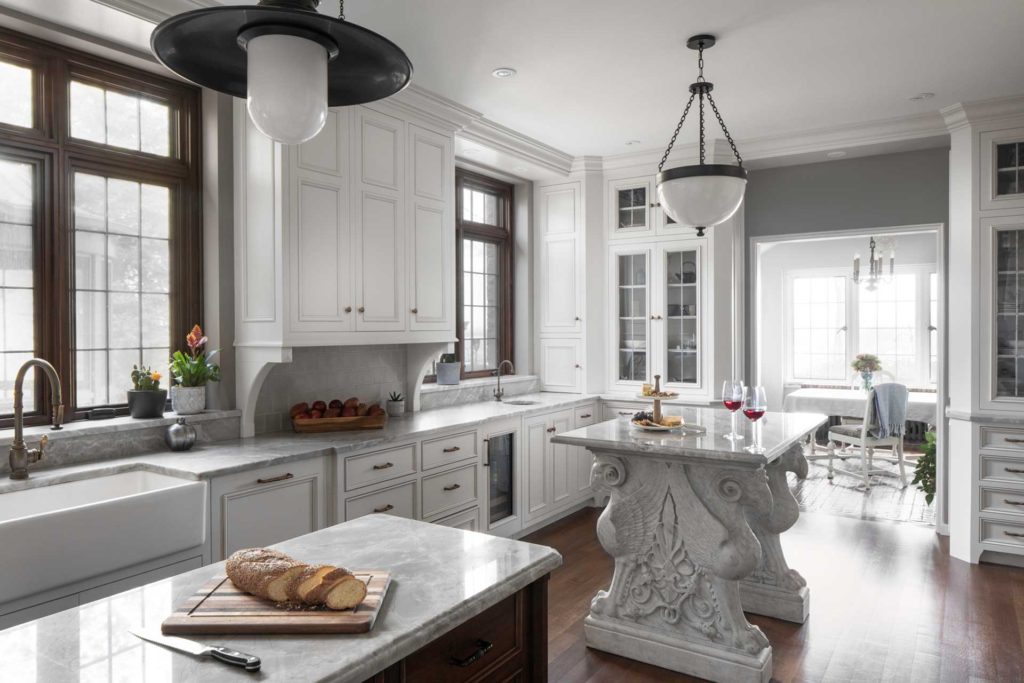 Large white kitchen with two islands