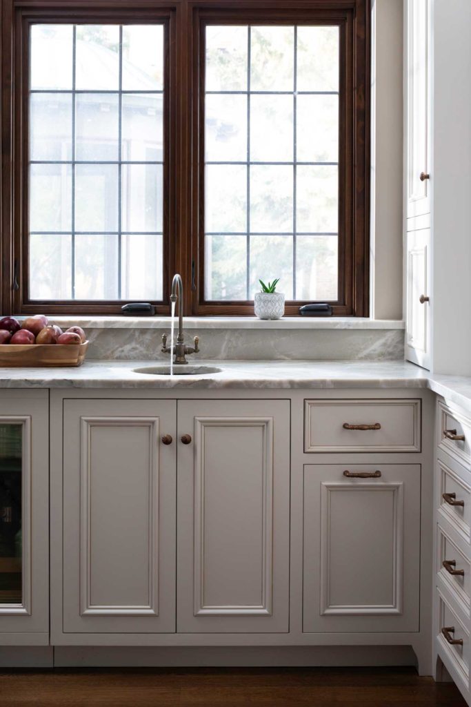 Kitchen sink with two large windows above