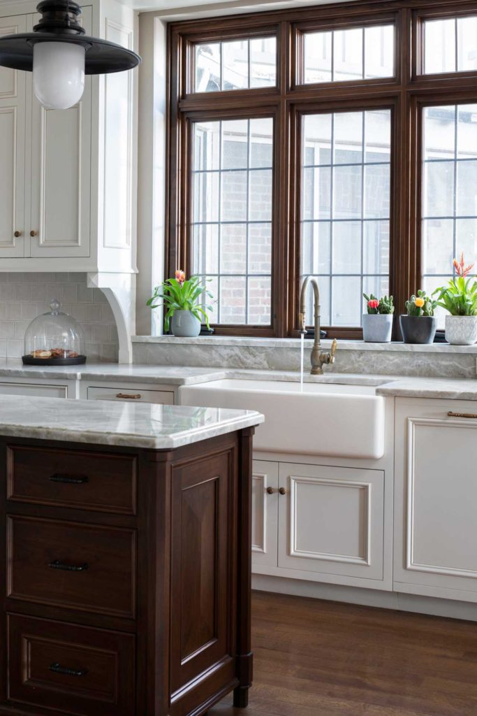 White farm sink with large windows above