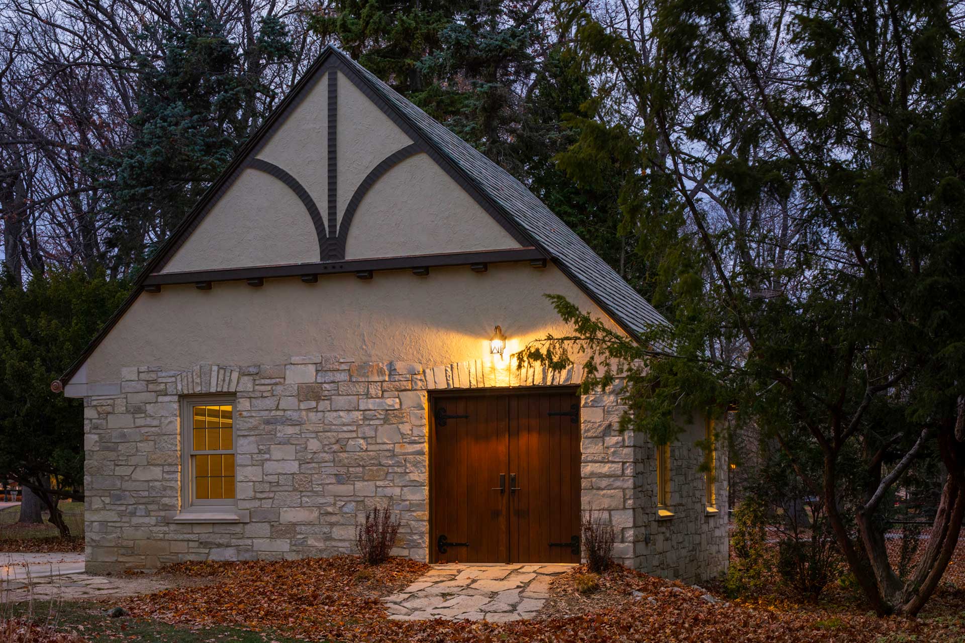 Side view of stone garage with lighting