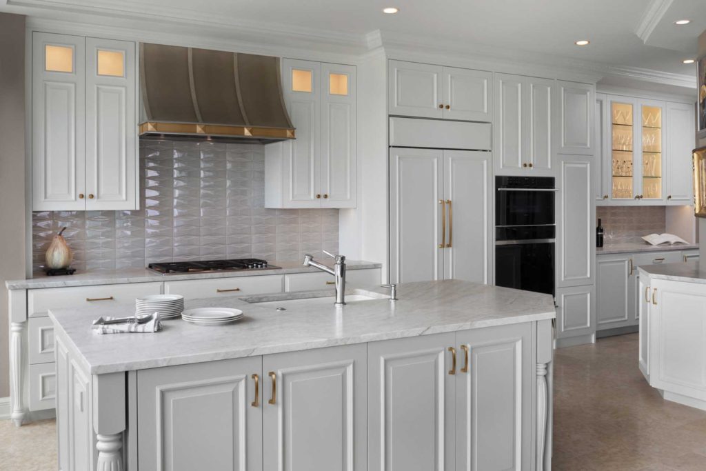 Kitchen view of sink island and cabinetry