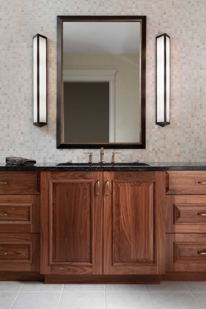Bathroom with large mirror and two vertical lights